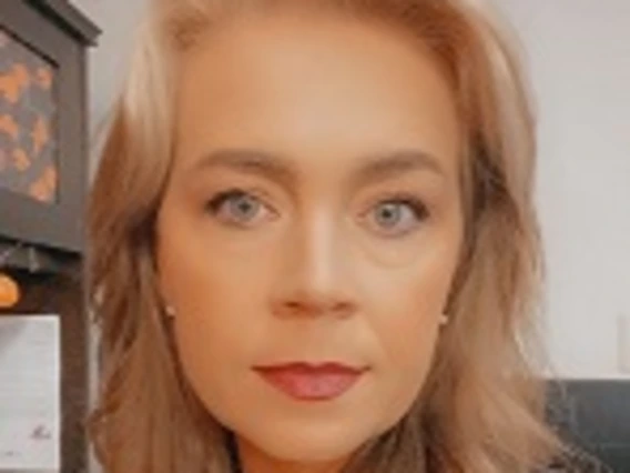 Kelley Benson looking into camera
