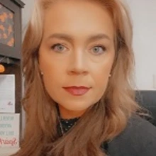 Kelley Benson looking into camera