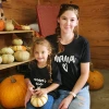 Photo of Amanda Vidimos and her daughter at a pumpkin patch