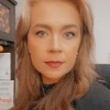 Kelley Benson looking into camera
